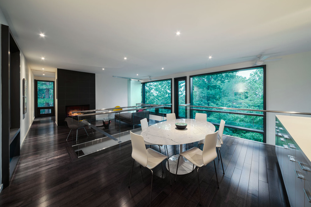 Design ideas for a modern open plan dining in Montreal with white walls, dark hardwood floors and brown floor.