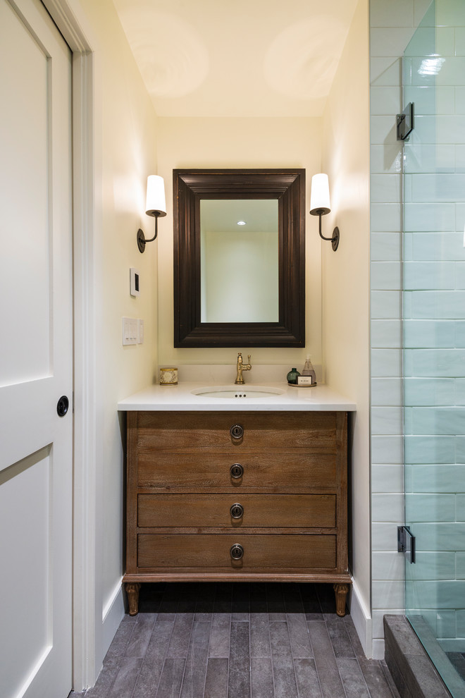 Small mountain style 3/4 white tile and ceramic tile porcelain tile and gray floor corner shower photo in Vancouver with flat-panel cabinets, medium tone wood cabinets, beige walls, an undermount sink, quartz countertops, a hinged shower door and white countertops