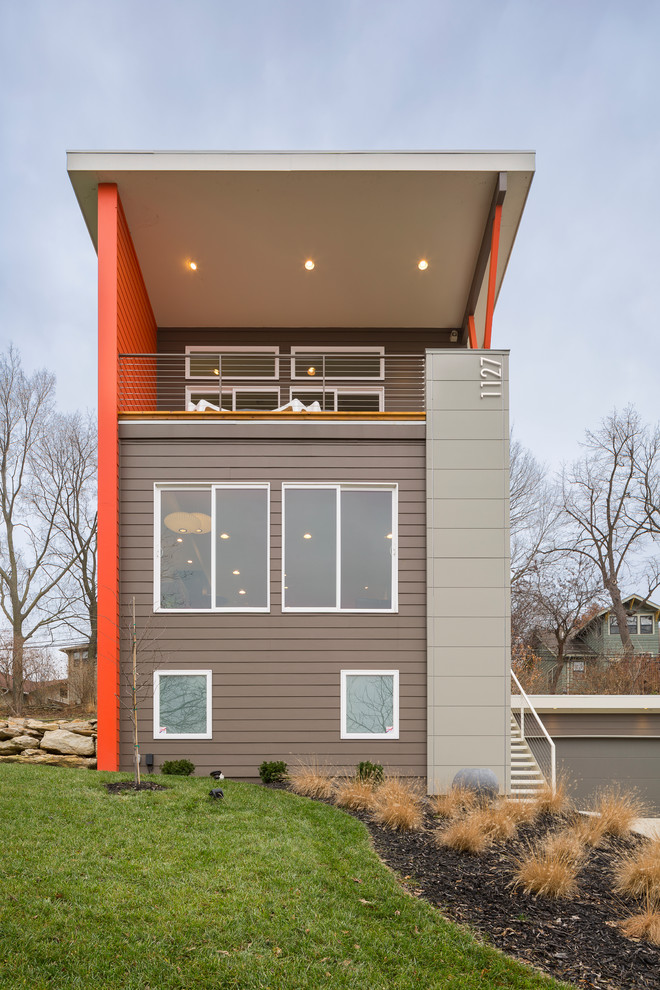 Trendy brown three-story exterior home photo in Kansas City