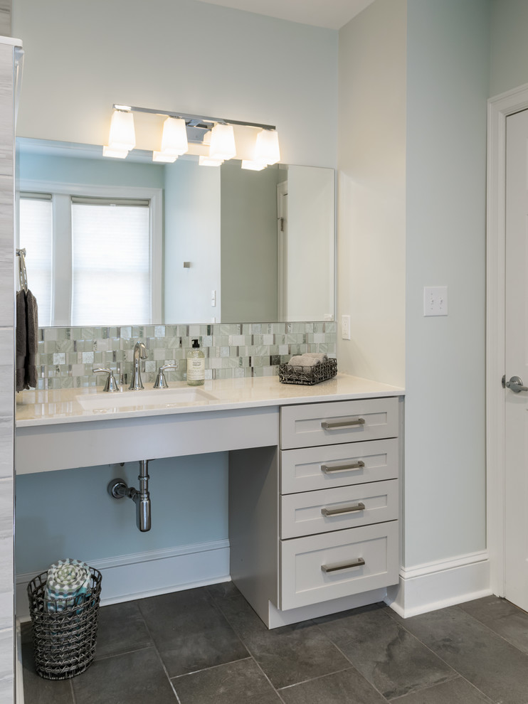 This is an example of a mid-sized contemporary master bathroom in St Louis with shaker cabinets, grey cabinets, blue tile, porcelain tile, onyx benchtops and multi-coloured benchtops.
