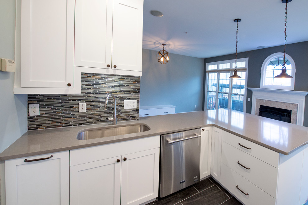 Example of a large trendy galley porcelain tile eat-in kitchen design in DC Metro with a single-bowl sink, shaker cabinets, white cabinets, quartz countertops, stainless steel appliances, a peninsula, multicolored backsplash and matchstick tile backsplash