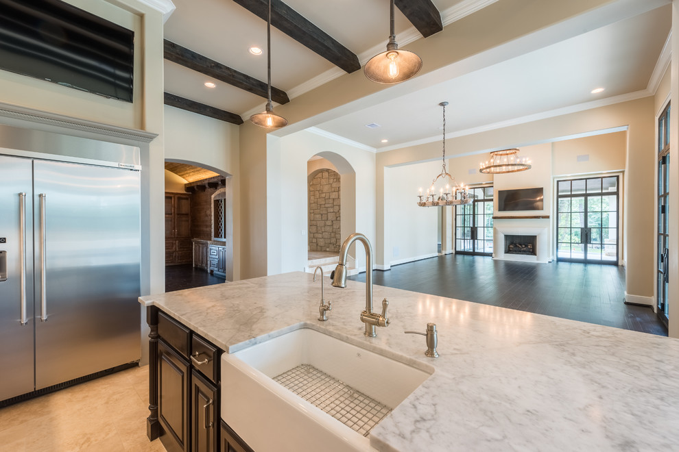 Inspiration for a huge transitional l-shaped porcelain tile and beige floor open concept kitchen remodel in Houston with a farmhouse sink, raised-panel cabinets, gray cabinets, marble countertops, gray backsplash, subway tile backsplash, stainless steel appliances, an island and white countertops