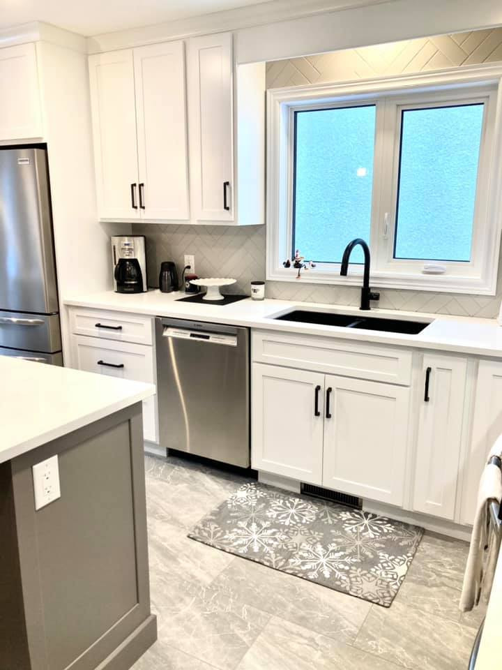Enclosed kitchen - mid-sized transitional galley ceramic tile and gray floor enclosed kitchen idea with a double-bowl sink, shaker cabinets, white cabinets, quartz countertops, gray backsplash, ceramic backsplash, stainless steel appliances, an island and white countertops