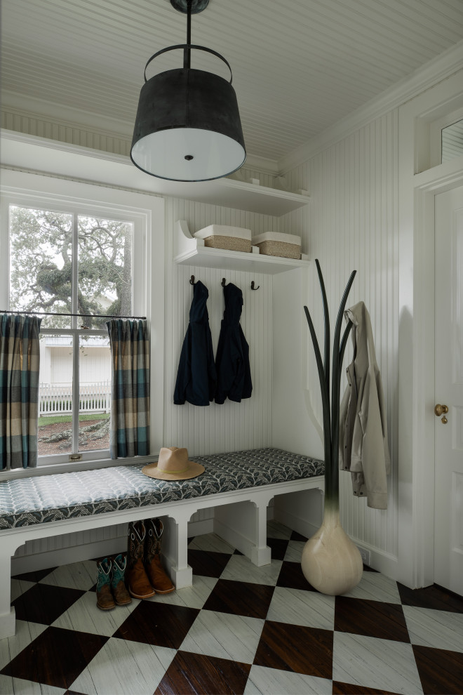 Design ideas for a small traditional mudroom in Houston with white walls, dark hardwood floors, brown floor, timber and planked wall panelling.