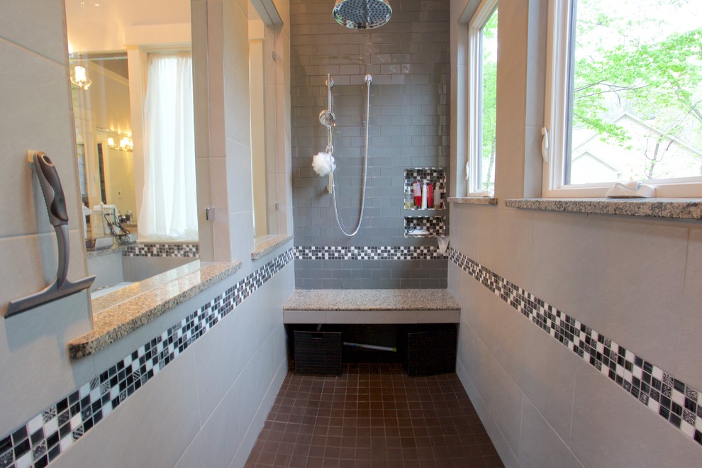 Huge transitional master black tile and ceramic tile concrete floor tub/shower combo photo with a vessel sink, distressed cabinets, wood countertops and beige walls