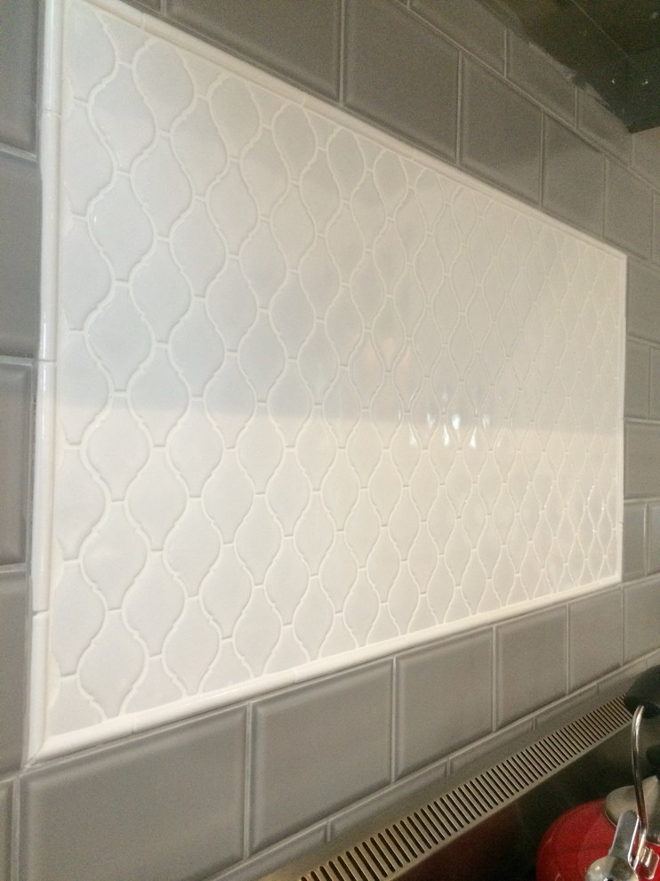 Example of a transitional kitchen design in Calgary