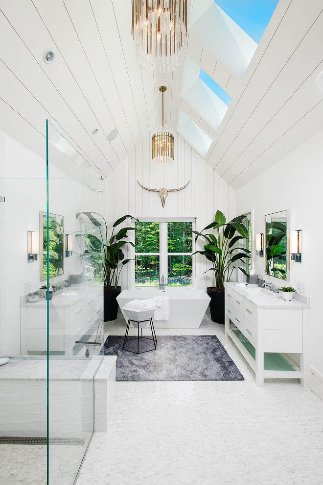 This is an example of a country master bathroom in New York with white cabinets, a freestanding tub, a curbless shower, white walls, an undermount sink, white floor, white benchtops, a shower seat, timber, planked wall panelling, a double vanity and flat-panel cabinets.