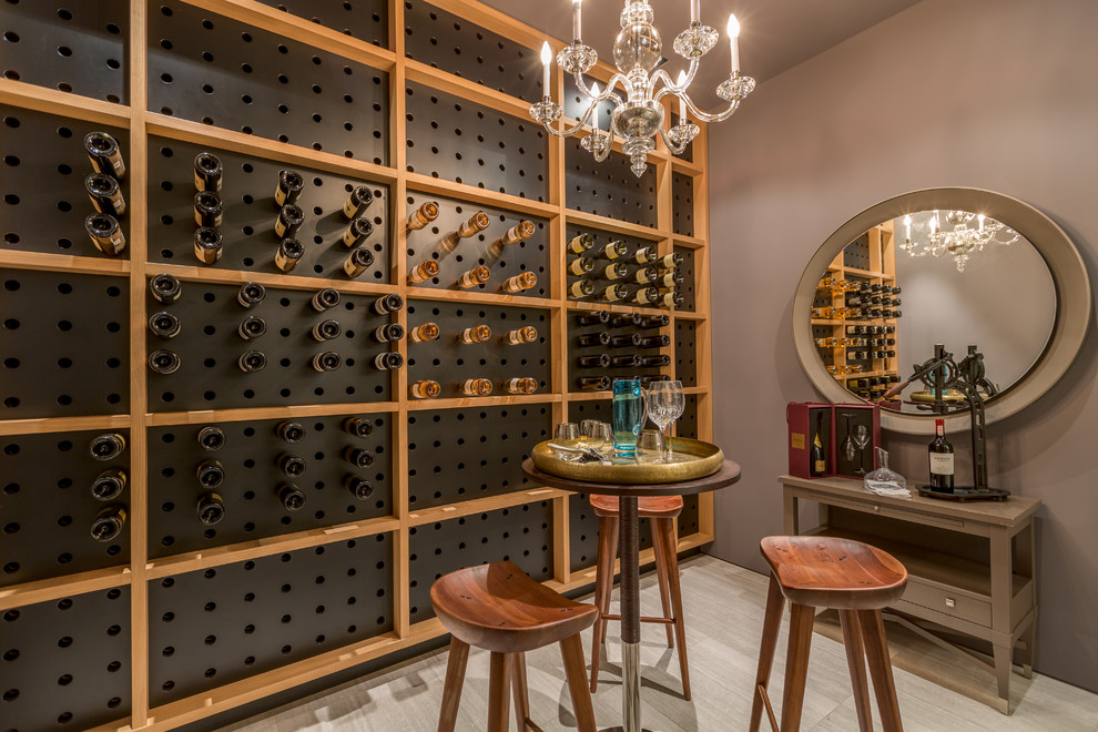 Design ideas for a contemporary wine cellar in Miami with storage racks and grey floor.