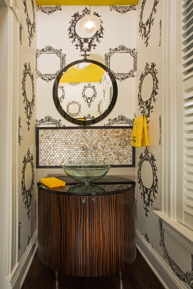 Design ideas for a small eclectic powder room in DC Metro with furniture-like cabinets, dark wood cabinets, a vessel sink, granite benchtops, laminate floors and brown floor.