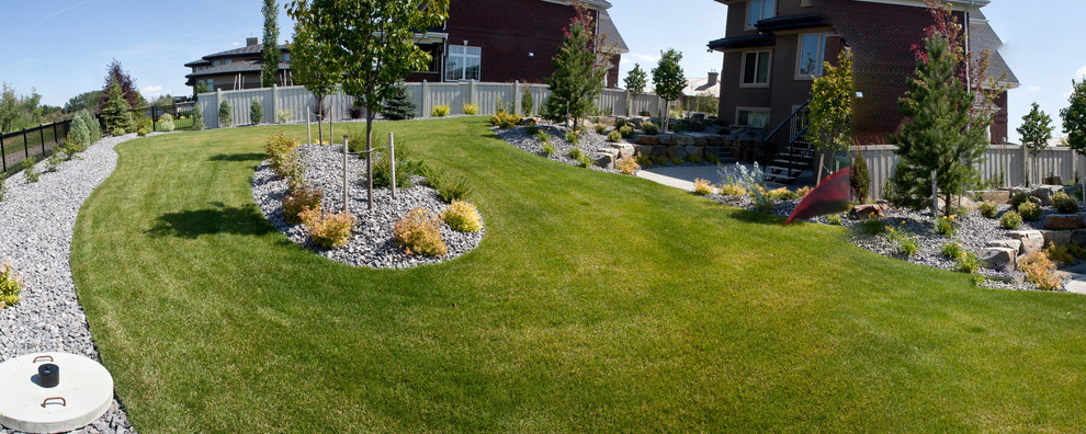 Design ideas for a mid-sized traditional partial sun backyard gravel outdoor sport court in Calgary for spring.