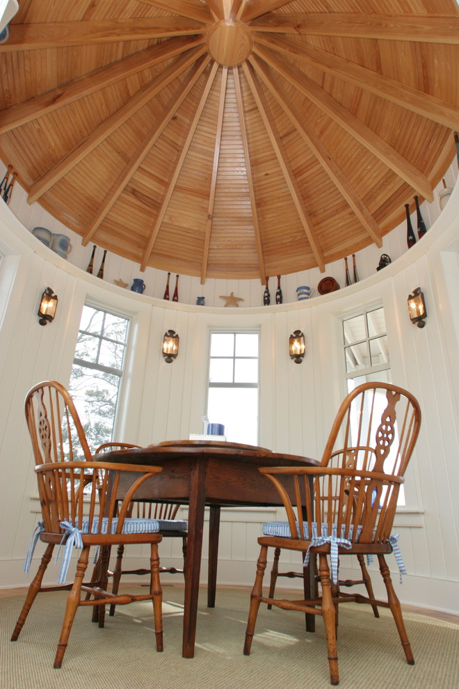This is an example of a beach style dining room in Raleigh.