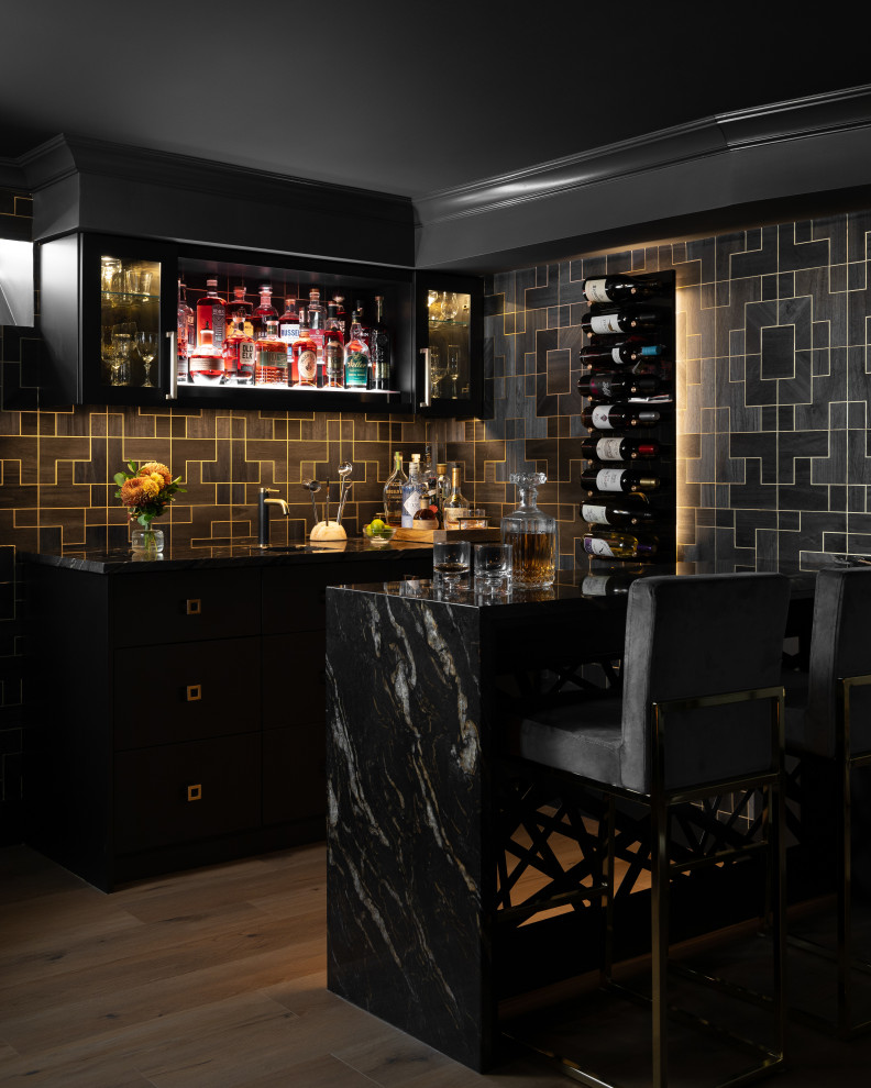 Photo of a small contemporary galley wet bar in Detroit with a submerged sink, flat-panel cabinets, black cabinets, marble worktops, black splashback, wood splashback, vinyl flooring, brown floors and black worktops.