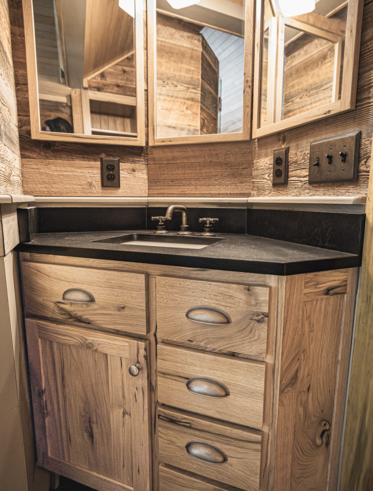 Inspiration for a rustic porcelain tile, single-sink, wood ceiling and wainscoting shower bench remodel with shaker cabinets, an undermount sink, granite countertops, a hinged shower door, black countertops and a built-in vanity