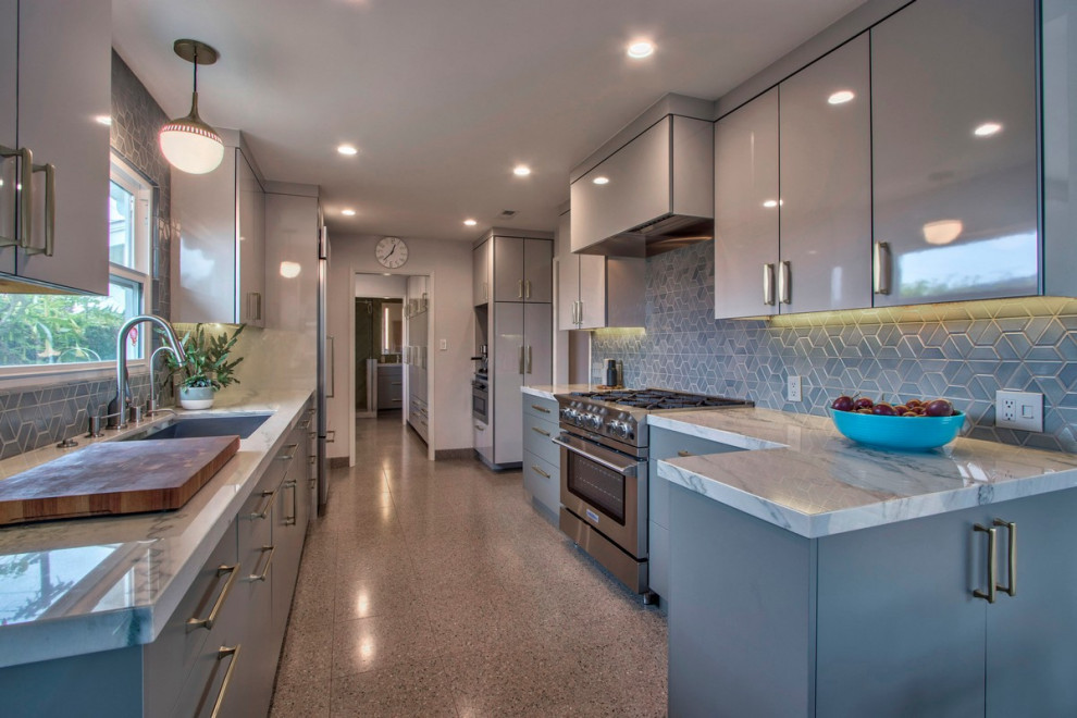 Design ideas for a mid-sized midcentury galley separate kitchen in San Diego with a single-bowl sink, flat-panel cabinets, grey cabinets, quartzite benchtops, blue splashback, ceramic splashback, panelled appliances, terrazzo floors, a peninsula, multi-coloured floor and white benchtop.