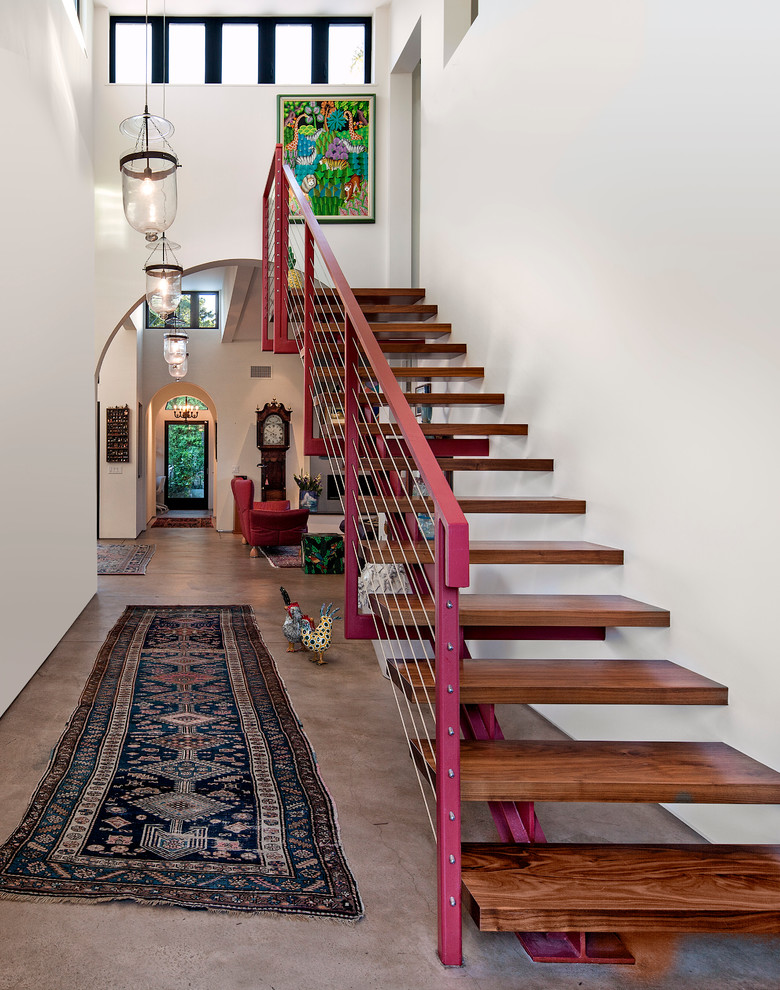Mid-sized mediterranean wood straight staircase in Santa Barbara with open risers.