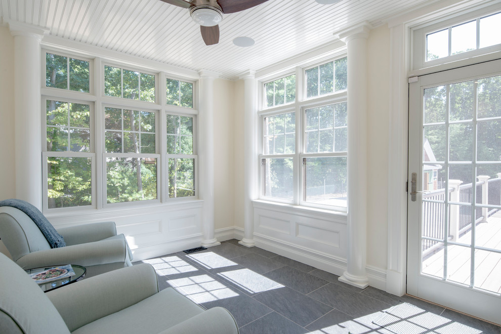 Photo of a mid-sized modern sunroom in Boston with porcelain floors, no fireplace, a standard ceiling and grey floor.
