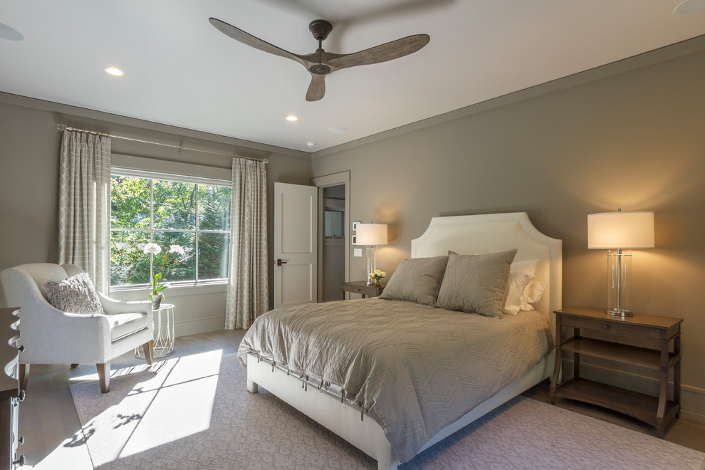 Design ideas for a country master bedroom in New York with grey walls and light hardwood floors.