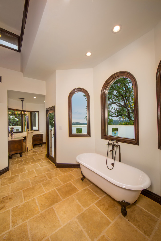 Large mediterranean master bathroom in Austin with recessed-panel cabinets, medium wood cabinets, a claw-foot tub, an alcove shower, beige tile, terra-cotta tile, white walls, terra-cotta floors, an undermount sink and granite benchtops.