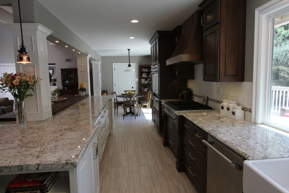 Eat-in kitchen - mid-sized rustic l-shaped porcelain tile eat-in kitchen idea in San Francisco with a farmhouse sink, recessed-panel cabinets, dark wood cabinets, wood countertops, white backsplash, subway tile backsplash, paneled appliances and an island
