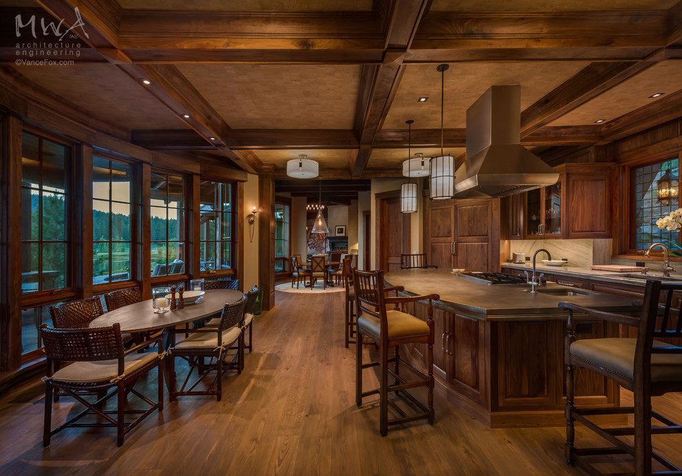 Eat-in kitchen - mid-sized transitional u-shaped medium tone wood floor eat-in kitchen idea with an undermount sink, raised-panel cabinets, medium tone wood cabinets, granite countertops, gray backsplash, stone slab backsplash, stainless steel appliances, an island and gray countertops