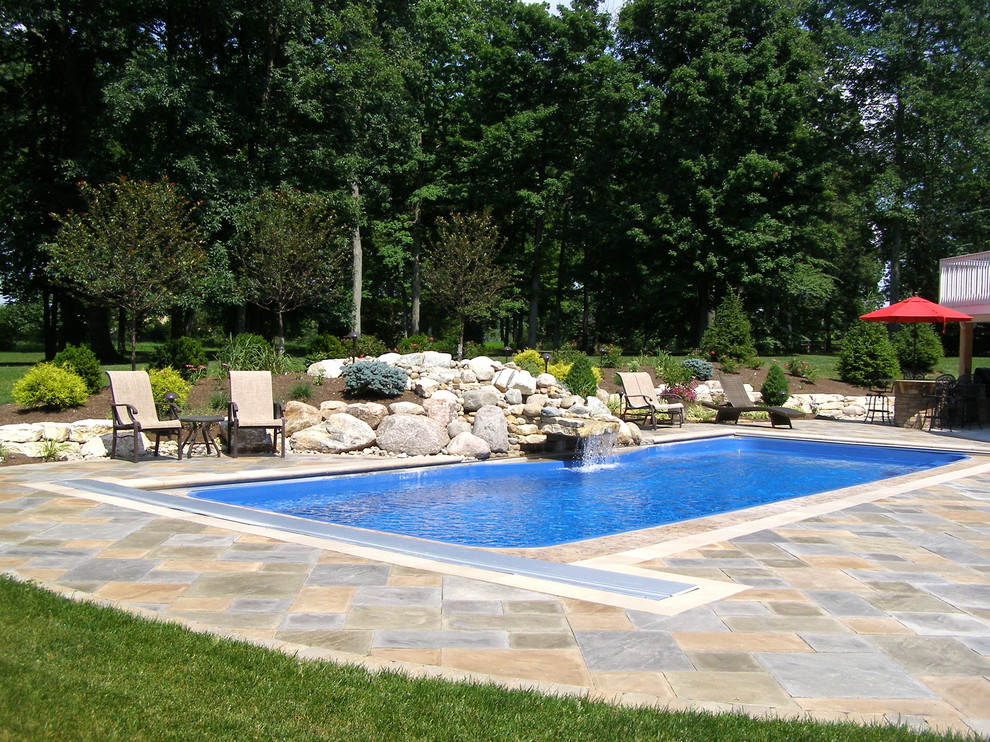 Inspiration for a rustic backyard stone aboveground pool remodel in Cincinnati