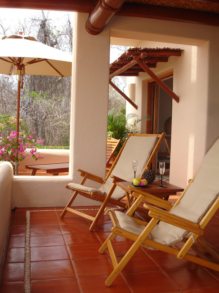 This is an example of a tropical balcony in Mexico City with a roof extension.