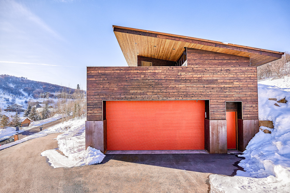 Photo of a contemporary attached two-car garage in Salt Lake City.