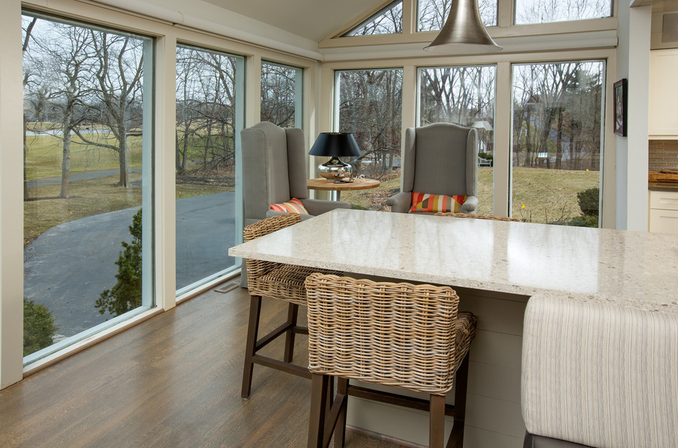 Example of a huge mountain style galley light wood floor great room design in Columbus with an undermount sink, shaker cabinets, beige cabinets, quartzite countertops, beige backsplash, glass tile backsplash, stainless steel appliances and an island