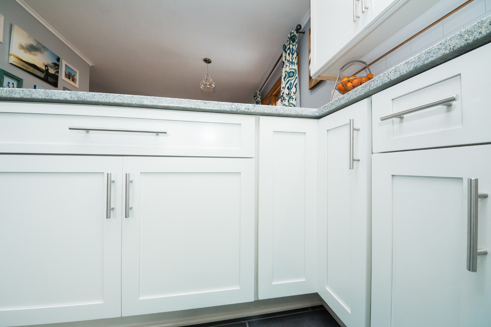 Mid-sized transitional l-shaped eat-in kitchen photo in Columbus with an undermount sink, shaker cabinets, white cabinets, granite countertops, white backsplash, subway tile backsplash and stainless steel appliances