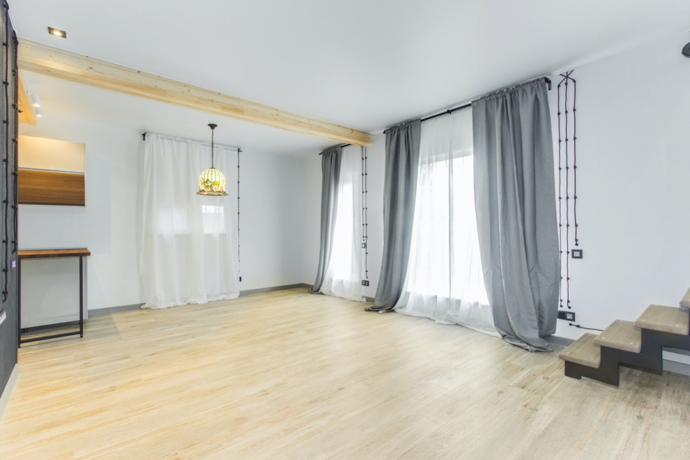 Esempio di un soggiorno design di medie dimensioni con pareti bianche, pavimento in gres porcellanato e pavimento grigio