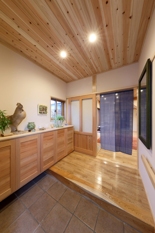 Photo of an entryway in Other with medium hardwood floors and wood.