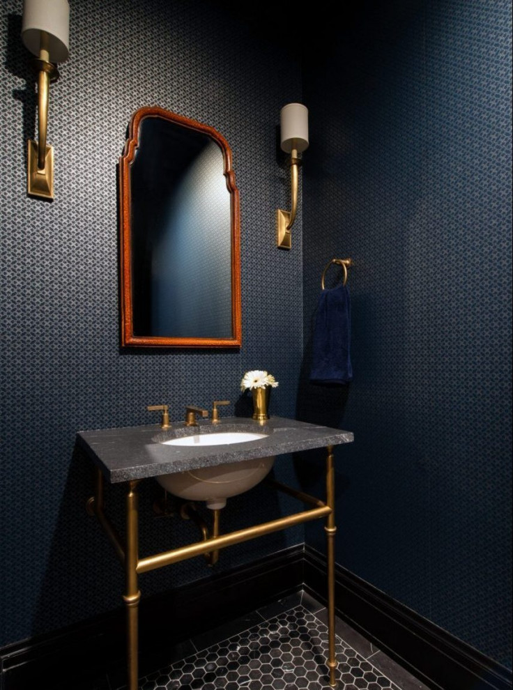 Photo of a mid-sized transitional powder room in Chicago with black cabinets, blue walls, marble benchtops, black benchtops, a freestanding vanity and wallpaper.