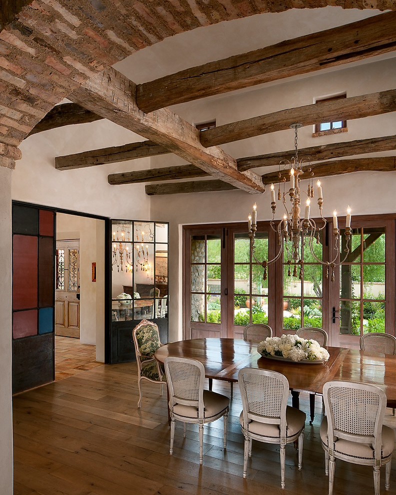 Inspiration for a separate dining room in Phoenix with beige walls and dark hardwood floors.