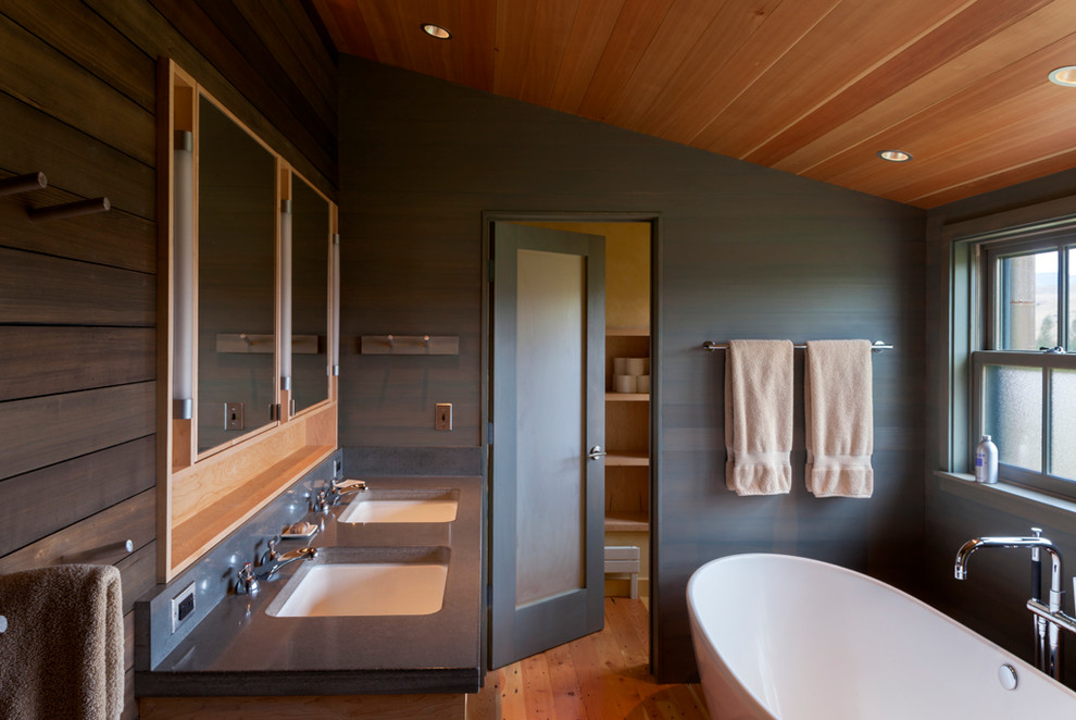 Inspiration for a country bathroom in Other with an undermount sink, a freestanding tub and grey benchtops.