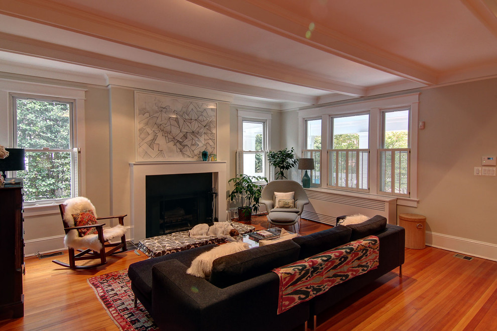 This is an example of a mid-sized eclectic living room in DC Metro with beige walls.