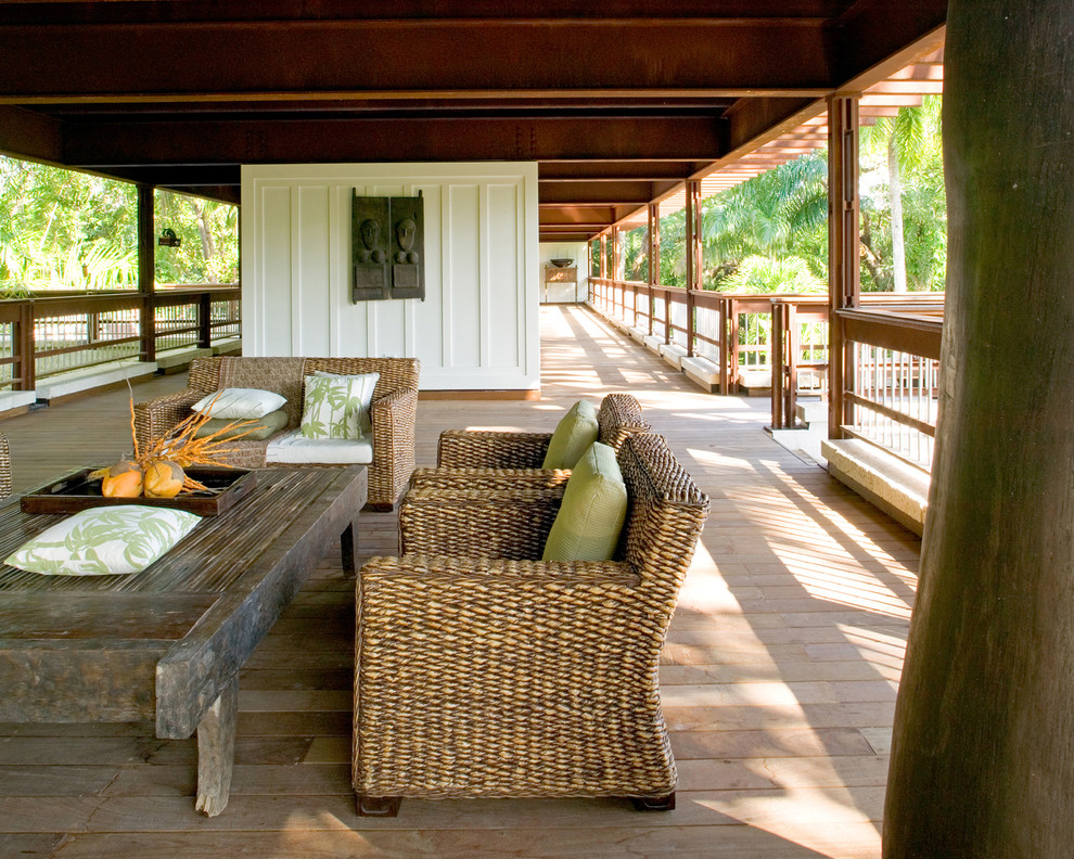 Design ideas for an expansive tropical verandah in Miami with decking and a roof extension.