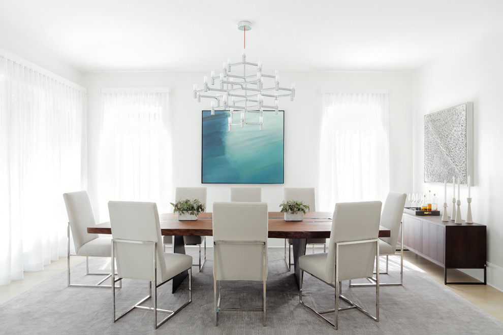Inspiration for a contemporary dining room in Atlanta with white walls and light hardwood floors.