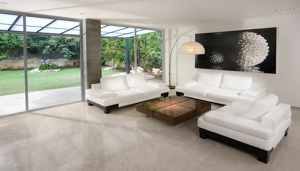 Photo of a modern living room in Other with white walls and marble floors.