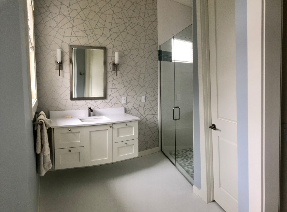 Photo of a medium sized traditional ensuite bathroom in Grand Rapids with double sinks and a floating vanity unit.