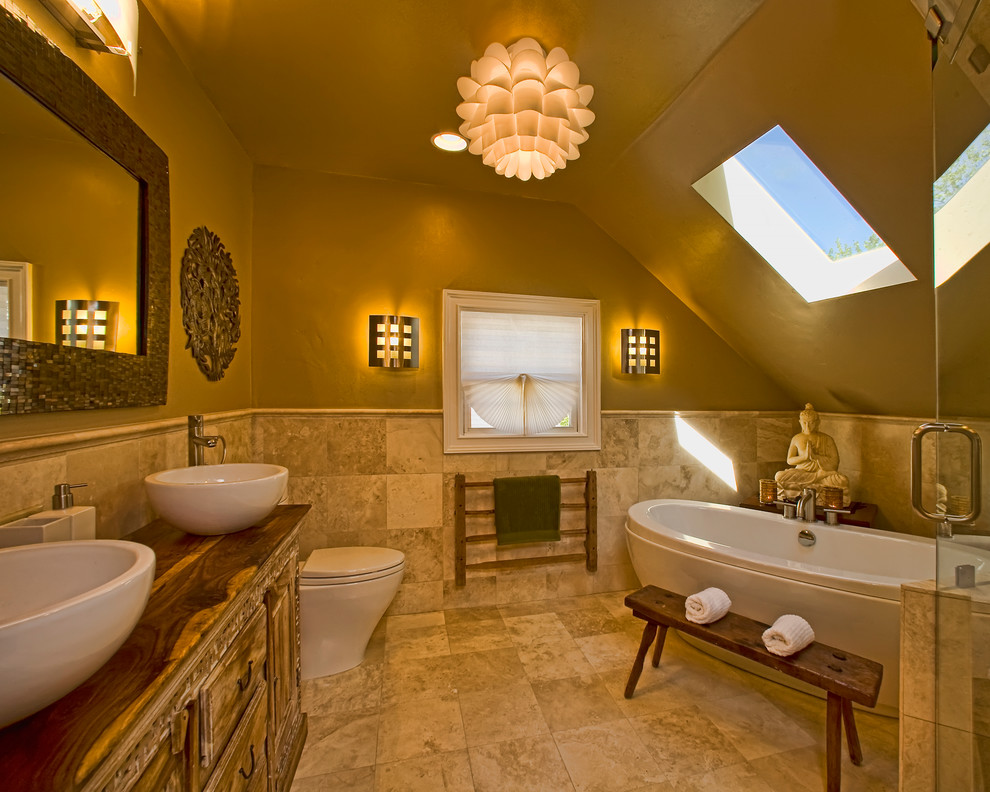 Contemporary bathroom in Sacramento with a freestanding tub and a vessel sink.