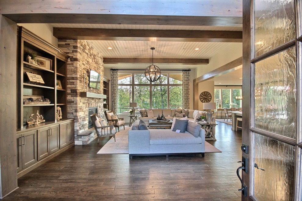 This is an example of an expansive arts and crafts foyer in Portland with beige walls, dark hardwood floors, a single front door, a dark wood front door and brown floor.