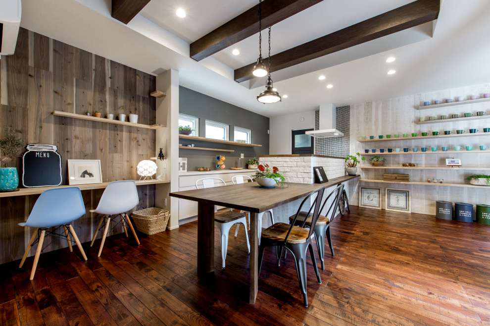 Kitchen/dining combo in Other with medium hardwood floors, wallpaper and wood walls.