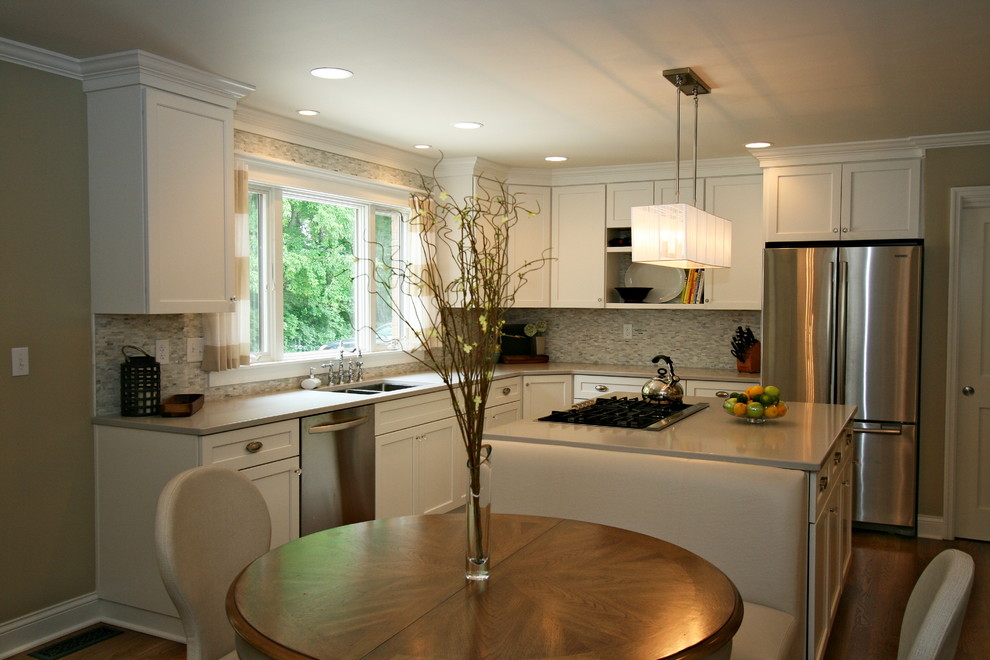 Large transitional medium tone wood floor kitchen photo in Cincinnati with a double-bowl sink, shaker cabinets, white cabinets, quartz countertops, gray backsplash, porcelain backsplash, stainless steel appliances and an island
