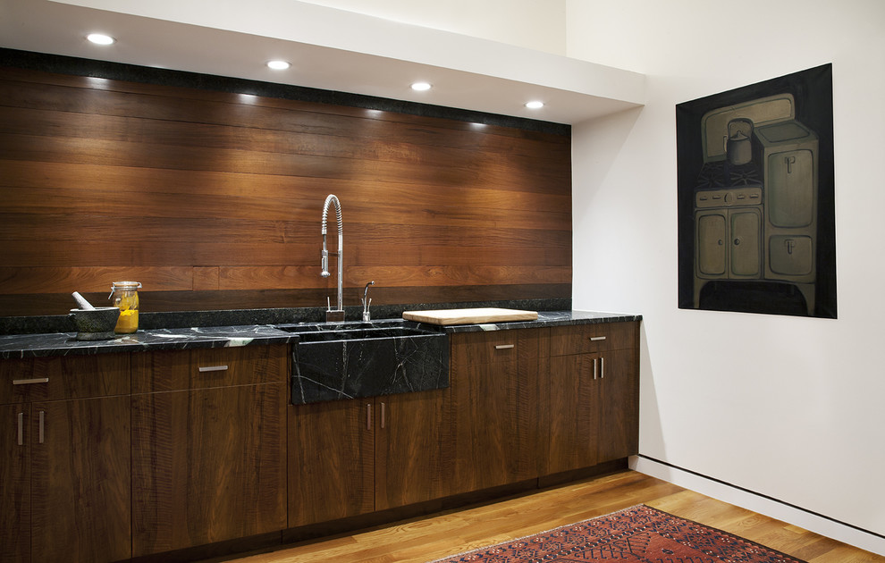 This is an example of a contemporary kitchen in Chicago with a farmhouse sink.