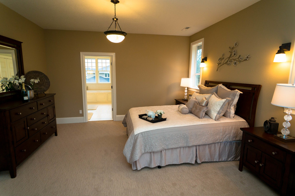 Inspiration for a large transitional master bedroom in Portland with beige walls, carpet and no fireplace.