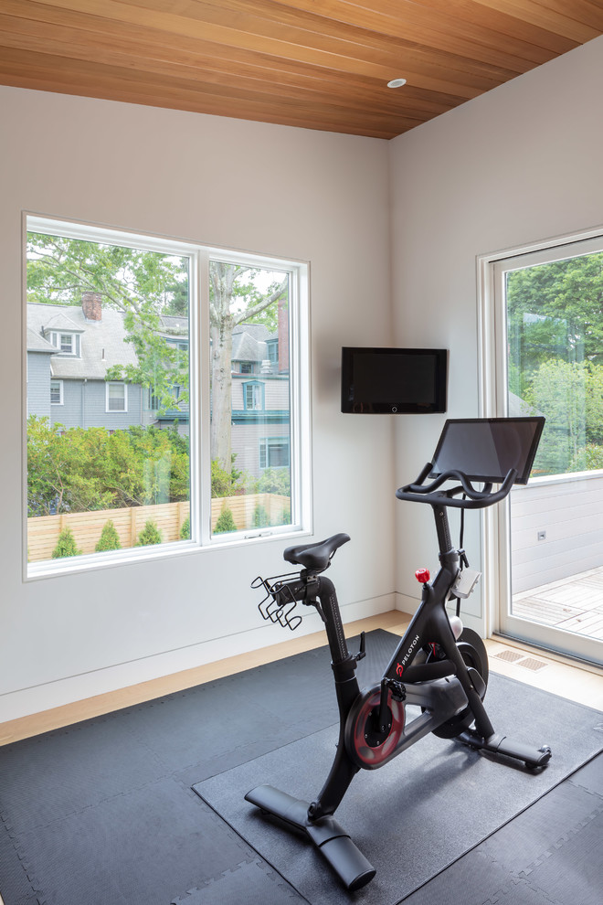 Mid-sized contemporary multipurpose gym in Providence with white walls, light hardwood floors and beige floor.