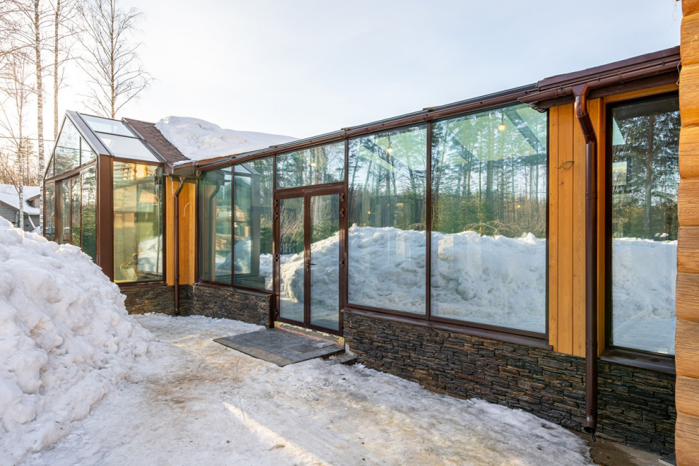 Строительство загородного дома с зимним садом с электрохромными стеклами перемен