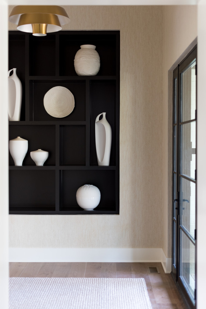 Entryway - mid-sized modern medium tone wood floor entryway idea in Indianapolis with beige walls and a medium wood front door
