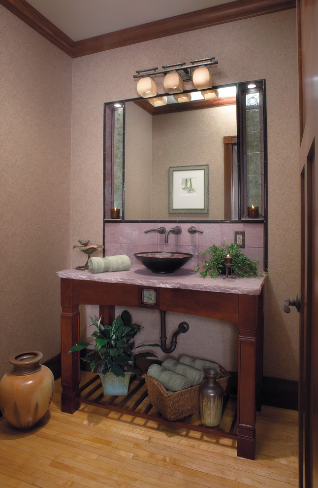 Inspiration for a small traditional 3/4 bathroom in Other with a vessel sink, dark wood cabinets, brown walls, light hardwood floors, open cabinets, quartzite benchtops and pink tile.