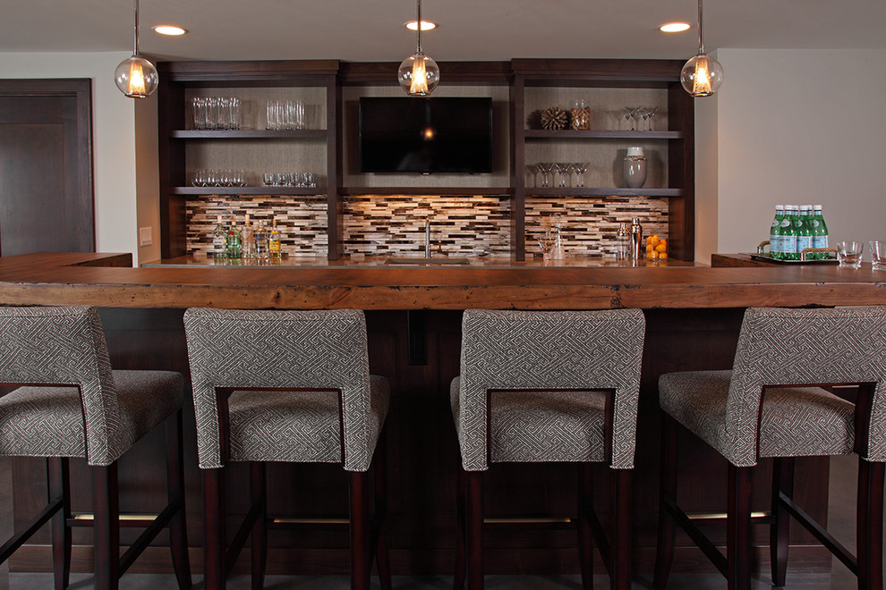 Mid-sized transitional galley seated home bar in Minneapolis with an undermount sink, open cabinets, dark wood cabinets, wood benchtops, multi-coloured splashback and matchstick tile splashback.